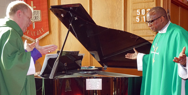 Bishop Andrew asks God's blessings on a recently donated memorial baby grand piano to the Glory of God.